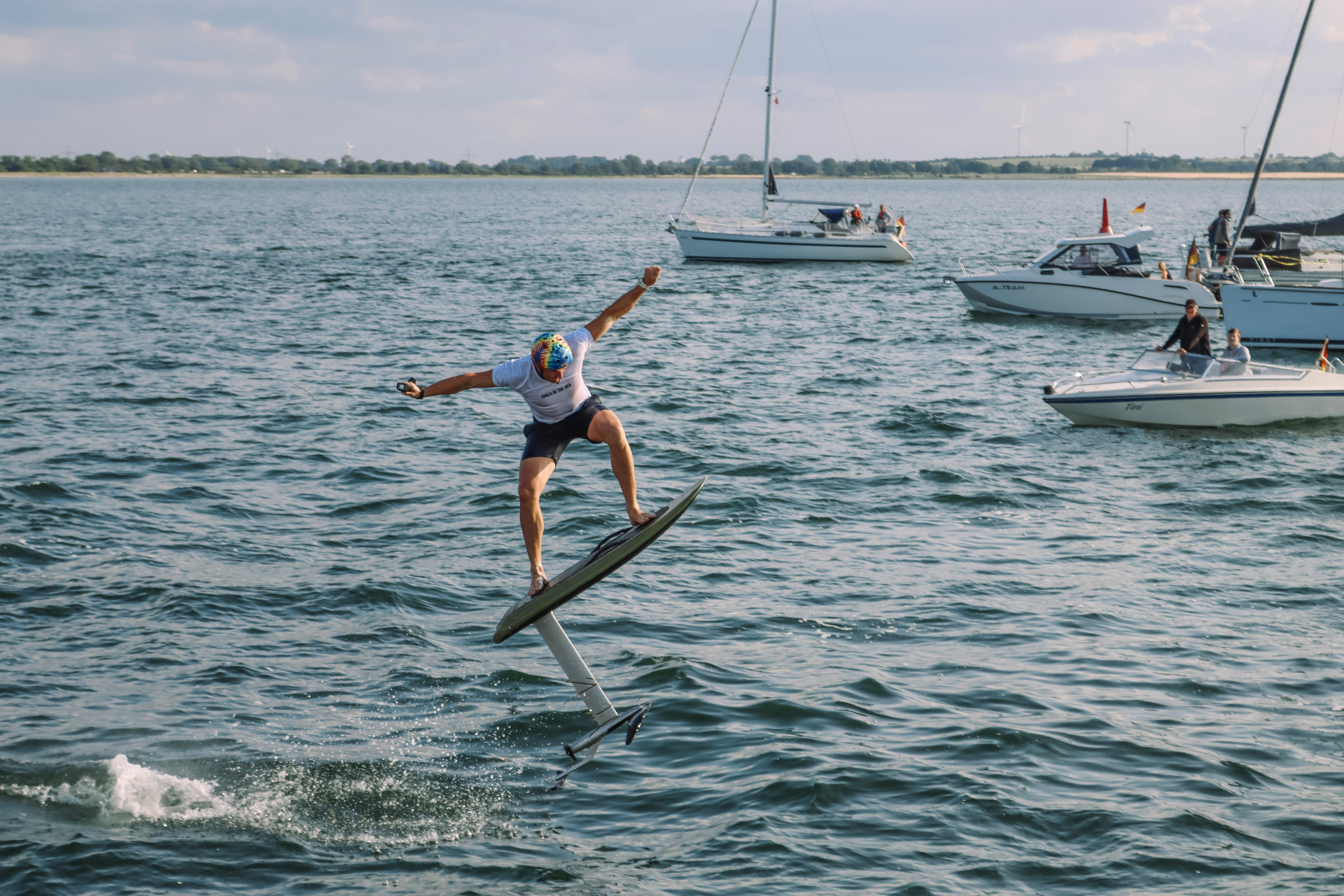 E-foil rider performing a trick above the water near Fehmarn